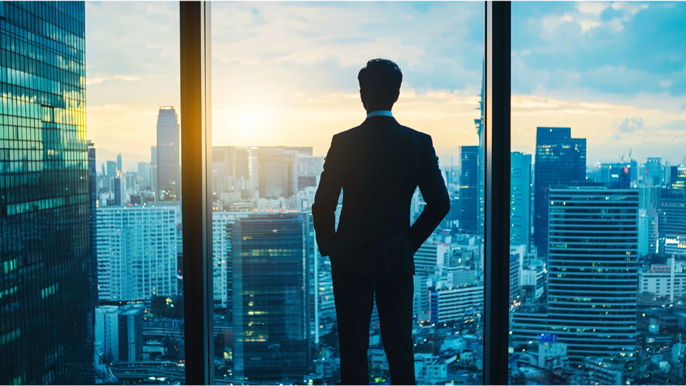 A business man standing and looking out